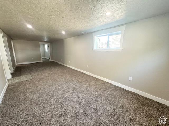 933 E 1150 N, Ogden, UT 84404 - basement featuring a textured ceiling, baseboards, carpet, and recessed lighting