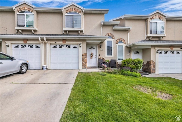 4728 W Mona Ln, West Jordan, UT 84084 - multi unit property featuring driveway, a garage, stucco siding, a front yard, and stone siding