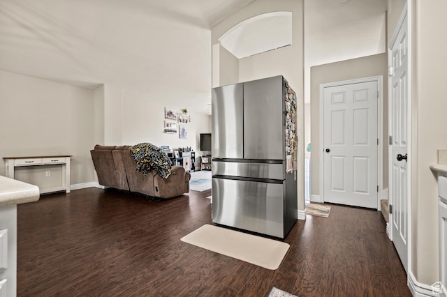 679 W 3600 S, Riverdale, UT 84405 - kitchen featuring dark wood-style flooring, freestanding refrigerator, open floor plan, baseboards, and light countertops