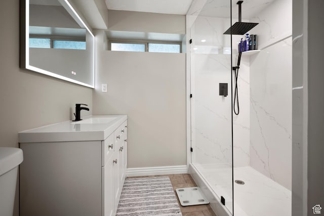 679 W 3600 S, Riverdale, UT 84405 - bathroom with vanity, toilet, a marble finish shower, and healthy amount of natural light