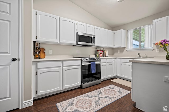 679 W 3600 S, Riverdale, UT 84405 - kitchen with stainless steel appliances, a sink, lofted ceiling, white cabinetry, and light countertops