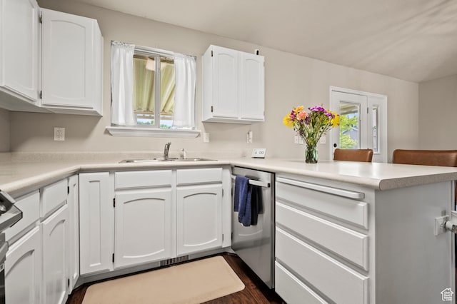 679 W 3600 S, Riverdale, UT 84405 - kitchen featuring dishwasher, a sink, a peninsula, and white cabinetry