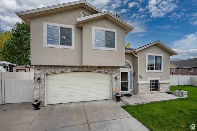 679 W 3600 S, Riverdale, UT 84405 - view of front of home with stucco siding, concrete driveway, an attached garage, brick siding, and stone siding