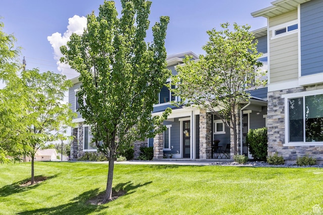 1722 W Naxos Ln, South Jordan, UT 84095 - view of front of house featuring a front lawn and stone siding