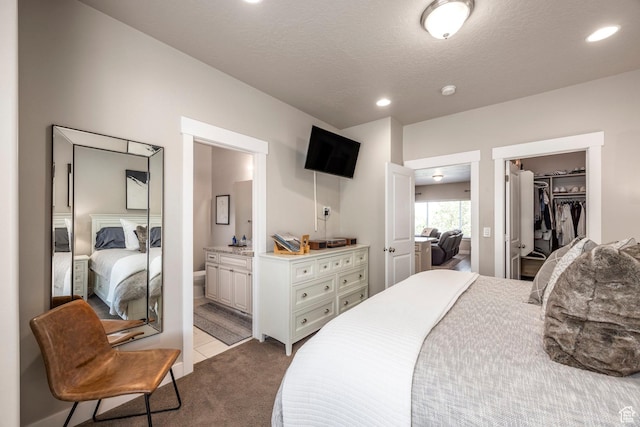1722 W Naxos Ln, South Jordan, UT 84095 - carpeted bedroom with a spacious closet, ensuite bath, recessed lighting, a closet, and a textured ceiling