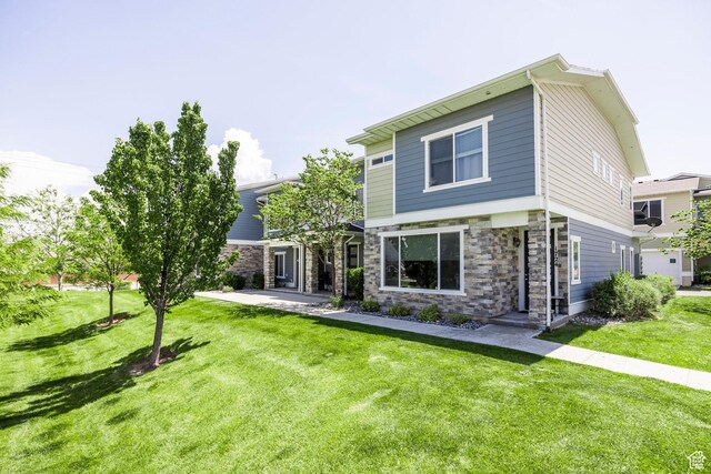 1722 W Naxos Ln, South Jordan, UT 84095 - view of front of home featuring stone siding and a front lawn