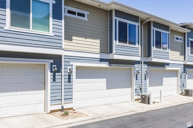 1722 W Naxos Ln, South Jordan, UT 84095 - view of property exterior with a garage and cooling unit