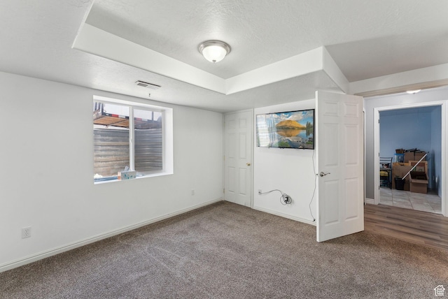 192 Starboard Ln, Stansbury Park, UT 84074 - unfurnished bedroom with carpet flooring, a textured ceiling, and baseboards