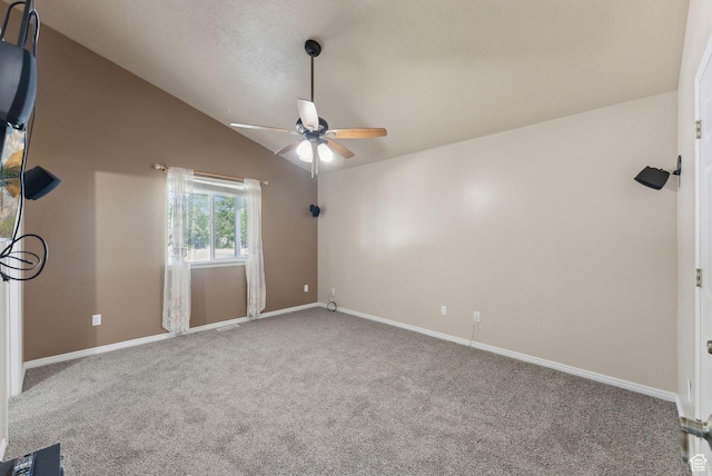 192 Starboard Ln, Stansbury Park, UT 84074 - spare room with a ceiling fan, carpet flooring, lofted ceiling, and baseboards