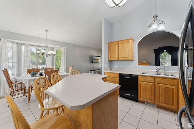 192 Starboard Ln, Stansbury Park, UT 84074 - kitchen featuring dishwasher, a sink, a chandelier, light tile patterned floors, and vaulted ceiling