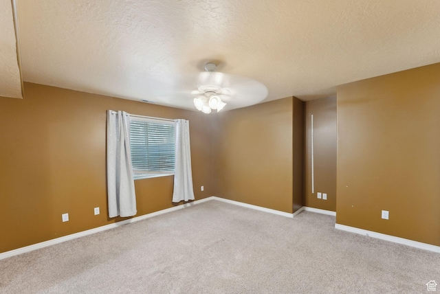 192 Starboard Ln, Stansbury Park, UT 84074 - carpeted empty room featuring a textured ceiling, baseboards, and ceiling fan