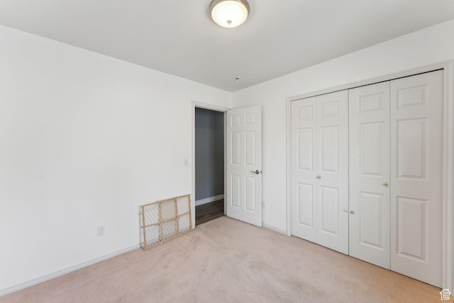 192 Starboard Ln, Stansbury Park, UT 84074 - unfurnished bedroom featuring carpet, a closet, and baseboards