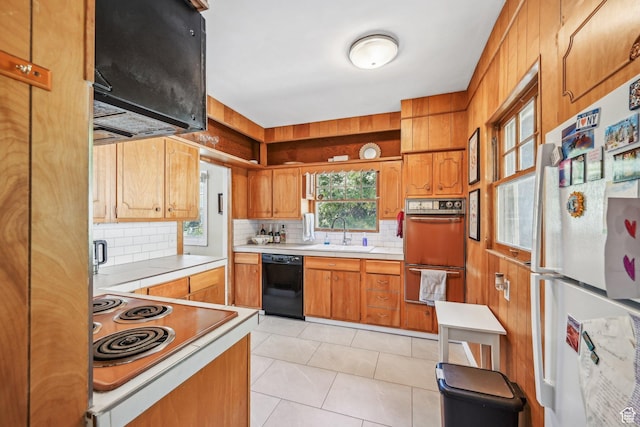 114 N Virginia St, Salt Lake City, UT 84103 - kitchen featuring freestanding refrigerator, dishwasher, a sink, double wall oven, and backsplash