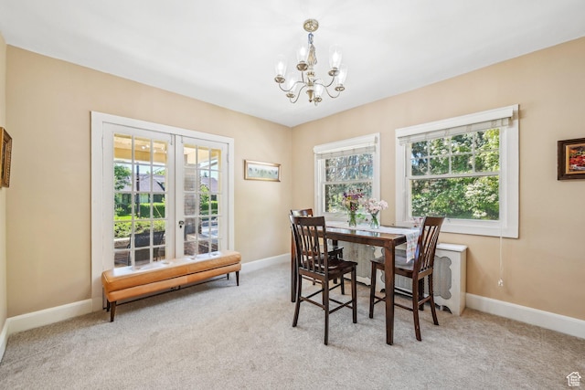 114 N Virginia St, Salt Lake City, UT 84103 - dining room featuring carpet, healthy amount of natural light, a chandelier, and baseboards