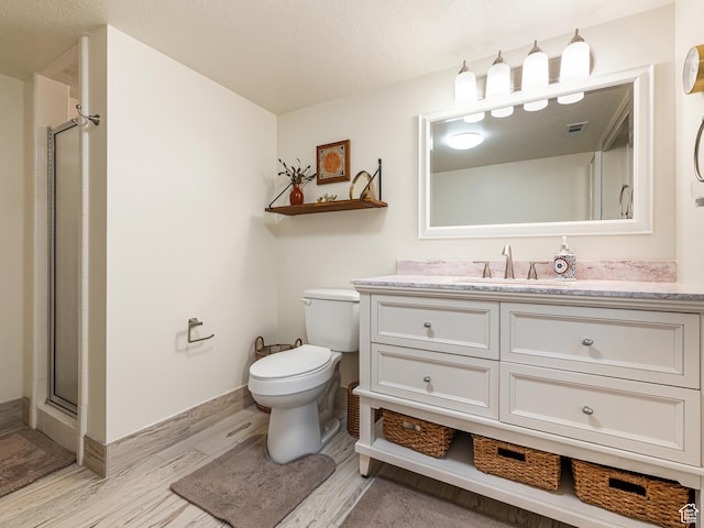 4968 S Partridge Way E, Ogden, UT 84403 - full bathroom featuring vanity, toilet, wood finished floors, and a shower stall
