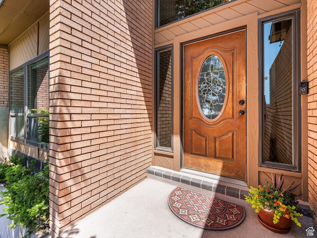 4968 S Partridge Way E, Ogden, UT 84403 - view of exterior entry with brick siding and a porch