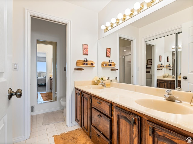 4968 S Partridge Way E, Ogden, UT 84403 - full bathroom featuring toilet, double vanity, tile patterned floors, an enclosed shower, and baseboards