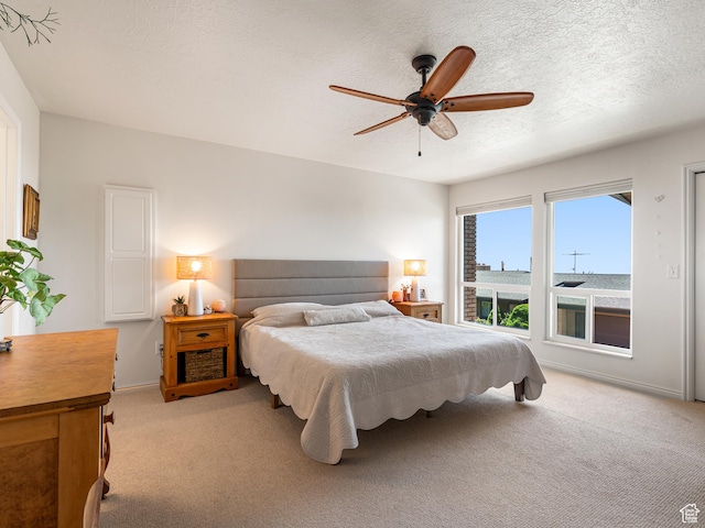 4968 S Partridge Way E, Ogden, UT 84403 - bedroom featuring light carpet, ceiling fan, baseboards, and a textured ceiling
