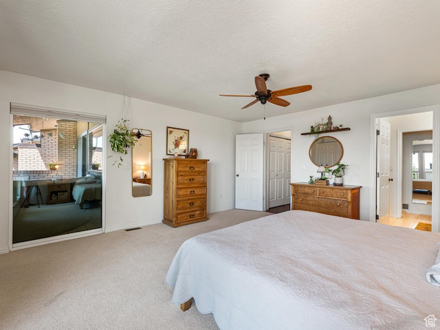 4968 S Partridge Way E, Ogden, UT 84403 - bedroom featuring light colored carpet, ceiling fan, access to exterior, baseboards, and a textured ceiling