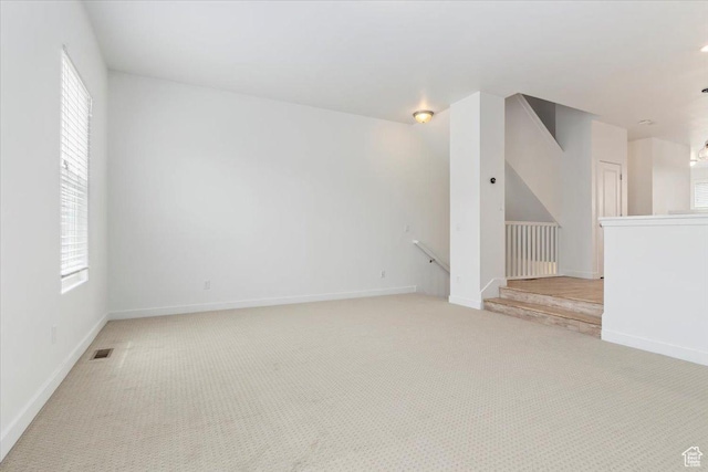 5377 W Bowstring Way S, Jordan, UT 84009 - unfurnished room with light carpet, plenty of natural light, and baseboards