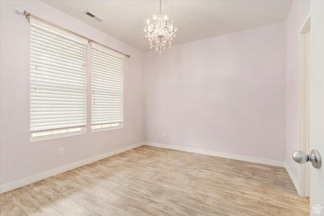5377 W Bowstring Way S, Jordan, UT 84009 - empty room with light wood-type flooring, a chandelier, and baseboards