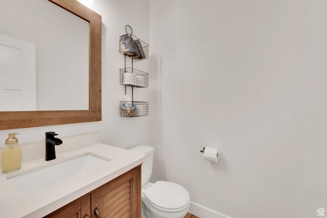 7859 N Sagebrush Ln, Eagle Mountain, UT 84005 - bathroom featuring toilet, vanity, and baseboards