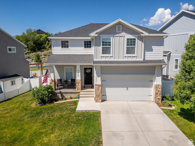 7859 N Sagebrush Ln, Eagle Mountain, UT 84005 - craftsman-style home featuring a porch, a garage, concrete driveway, and stone siding
