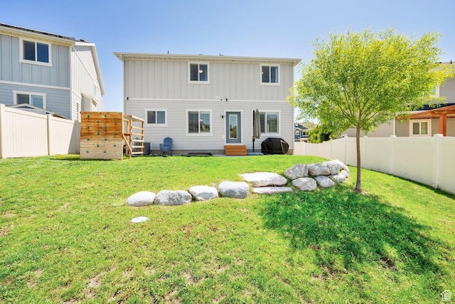 7859 N Sagebrush Ln, Eagle Mountain, UT 84005 - rear view of property with entry steps and board and batten siding