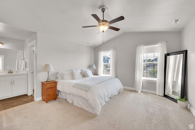 7859 N Sagebrush Ln, Eagle Mountain, UT 84005 - carpeted bedroom featuring baseboards, lofted ceiling, connected bathroom, and ceiling fan