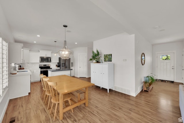 7859 N Sagebrush Ln, Eagle Mountain, UT 84005 - dining area featuring light wood-style floors, recessed lighting, and baseboards