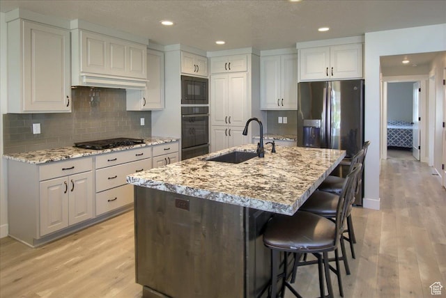 4016 W 625 S, West Point, UT 84015 - kitchen featuring black appliances, a sink, light wood-type flooring, backsplash, and recessed lighting