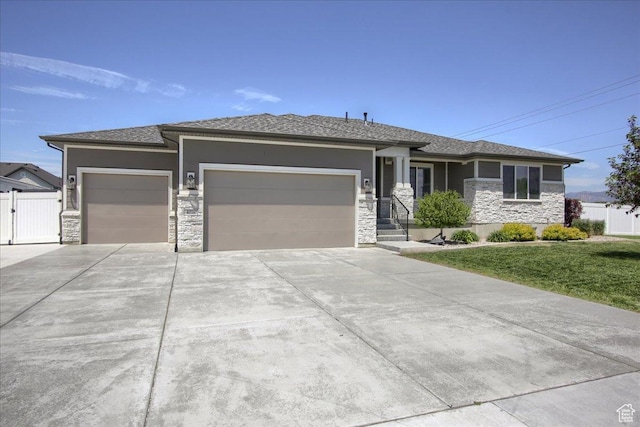 4016 W 625 S, West Point, UT 84015 - prairie-style home featuring stone siding, an attached garage, concrete driveway, and stucco siding