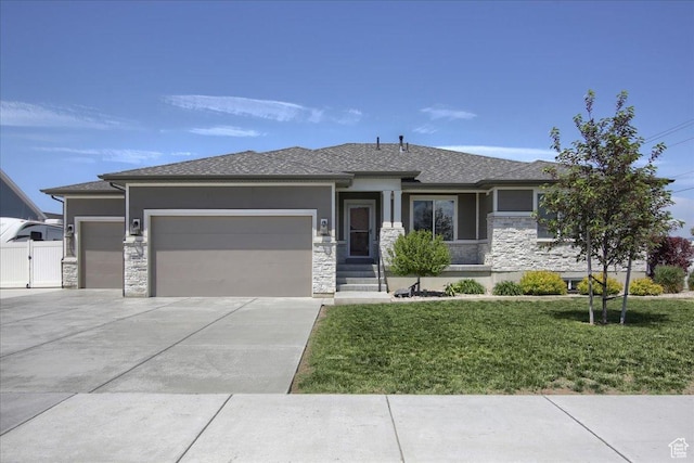 4016 W 625 S, West Point, UT 84015 - prairie-style house with stone siding, a garage, driveway, a front yard, and stucco siding