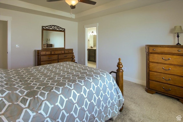 4016 W 625 S, West Point, UT 84015 - bedroom featuring light colored carpet, ceiling fan, ensuite bathroom, and a tray ceiling