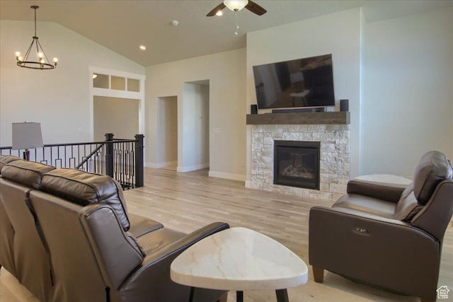 4016 W 625 S, West Point, UT 84015 - living area featuring a chandelier, light wood-style flooring, ceiling fan, vaulted ceiling, and a fireplace