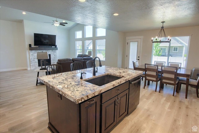 4016 W 625 S, West Point, UT 84015 - kitchen featuring a sink, dishwasher, light wood-style flooring, a ceiling fan, and dark brown cabinetry