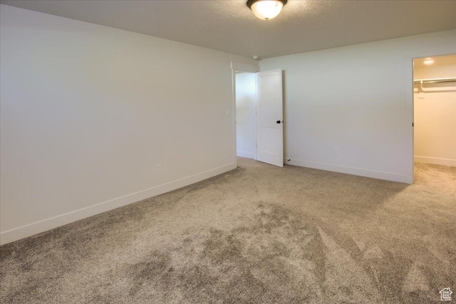 4016 W 625 S, West Point, UT 84015 - unfurnished bedroom with carpet, baseboards, a spacious closet, a closet, and a textured ceiling