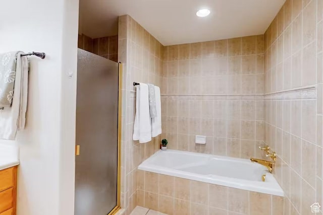 1096 S Bentley Blvd, Cedar City, UT 84720 - full bathroom with a stall shower, vanity, a garden tub, and tile walls