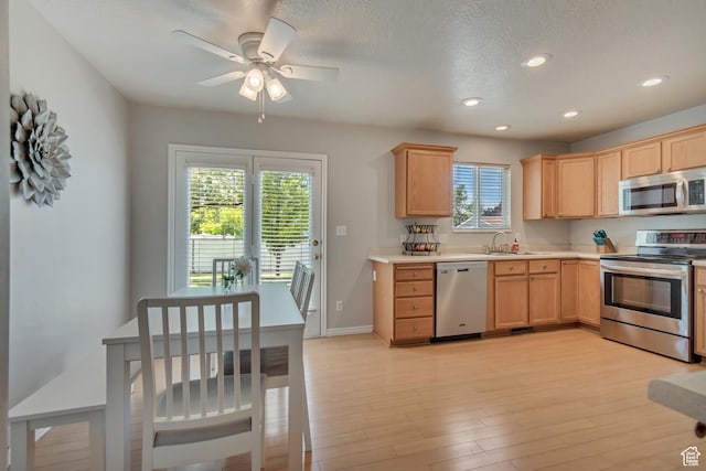 775 N 250 W, Springville, UT 84663 - kitchen with appliances with stainless steel finishes, a sink, recessed lighting, light wood-type flooring, and plenty of natural light