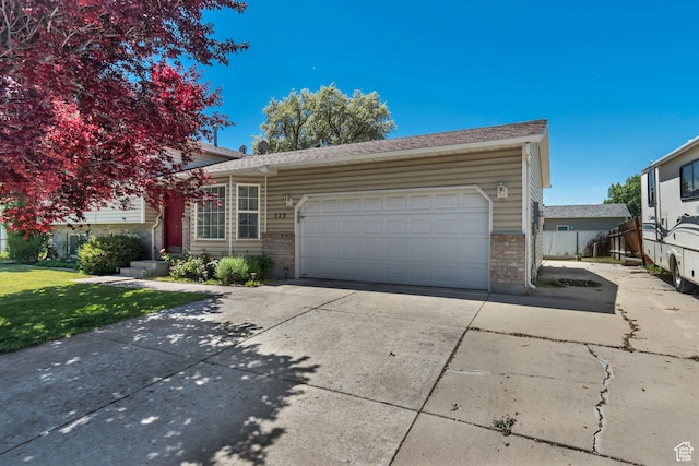 775 N 250 W, Springville, UT 84663 - view of front facade featuring brick siding, driveway, an attached garage, and a front yard