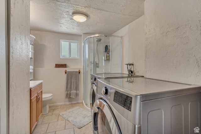 775 N 250 W, Springville, UT 84663 - bathroom with a shower stall, toilet, vanity, a textured ceiling, and tile patterned floors