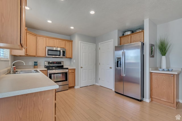 775 N 250 W, Springville, UT 84663 - kitchen featuring appliances with stainless steel finishes, a sink, light countertops, recessed lighting, and baseboards
