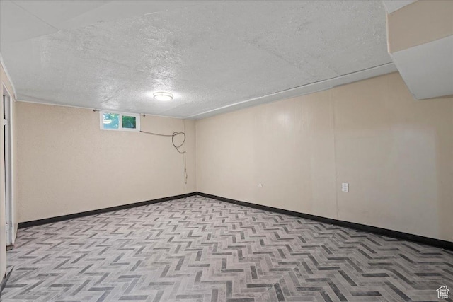 917 E Sullivan Rd, Ogden, UT 84403 - basement with a textured ceiling and baseboards