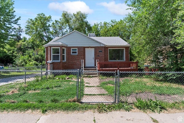 917 E Sullivan Rd, Ogden, UT 84403 - view of front of home with a gate, a fenced front yard, and brick siding