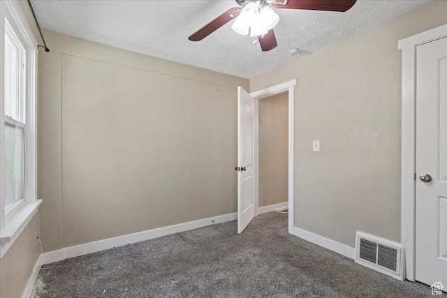 917 E Sullivan Rd, Ogden, UT 84403 - empty room featuring a textured ceiling, ceiling fan, carpet flooring, and baseboards