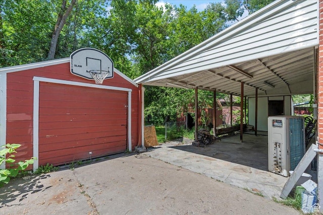 917 E Sullivan Rd, Ogden, UT 84403 - garage with concrete driveway and a cooling unit