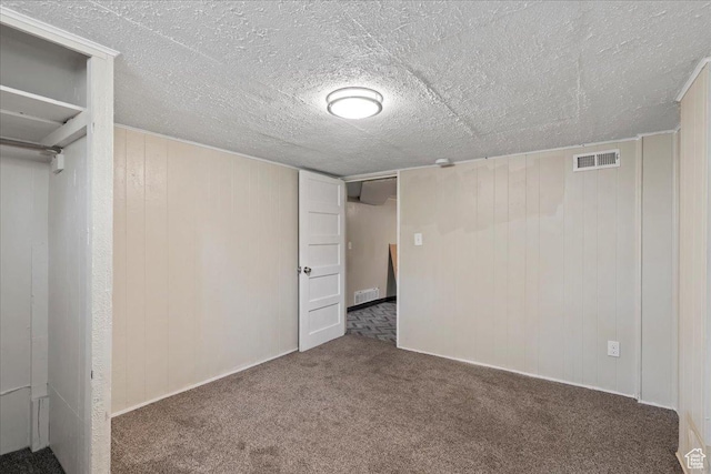 917 E Sullivan Rd, Ogden, UT 84403 - unfurnished bedroom with carpet flooring and wood walls