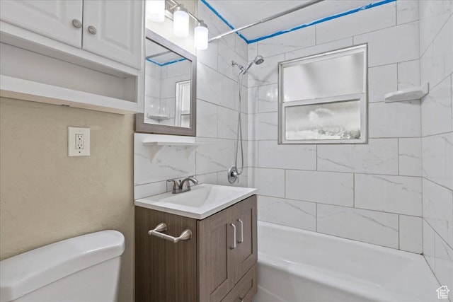 917 E Sullivan Rd, Ogden, UT 84403 - bathroom featuring toilet,  shower combination, vanity, and backsplash