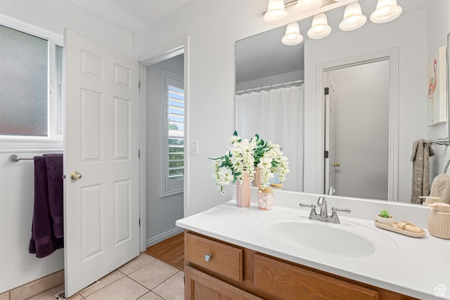 11770 S Dry Creek Rd, Sandy, UT 84094 - full bathroom featuring vanity, tile patterned flooring, and baseboards