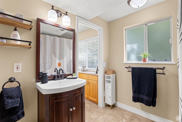 11770 S Dry Creek Rd, Sandy, UT 84094 - full bathroom featuring vanity, tile patterned flooring, and baseboards